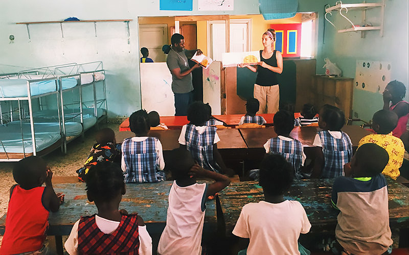 Lindsey Haas teaching in a Haitian classroom.