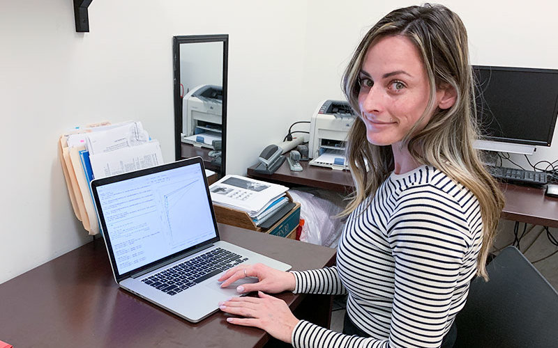 MARC Researcher Kendra Paquette works on her cpmputer.