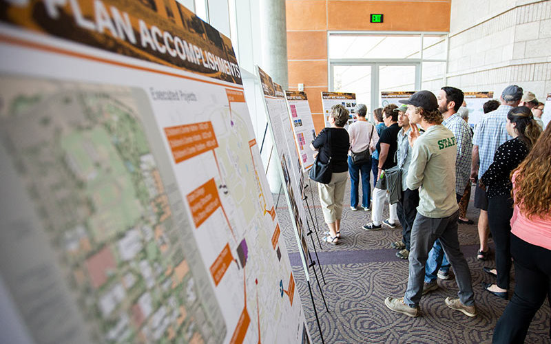 Pubilic forum attendees looking at planning posters.