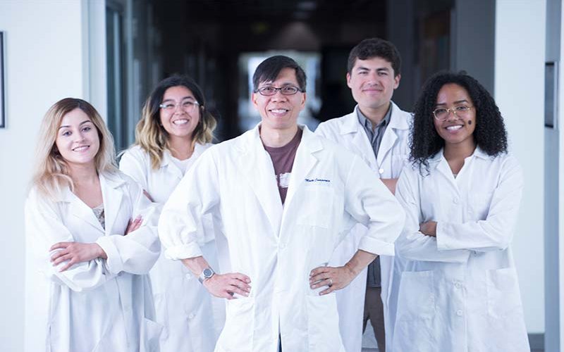 Math P. Cuajungco with his current and former student researchers