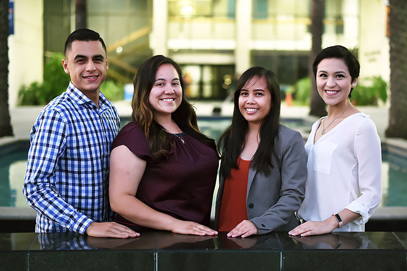 Graduate students standing in front of Langsdorf Hall. Michael Yepez, from left, Esmeralda Trejo, Shannen Allado and Kenitza Carrillo