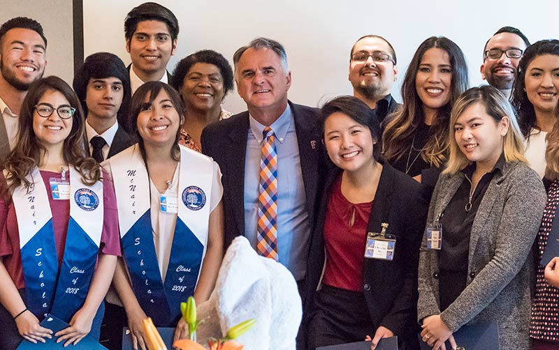 Graduating McNair Scholars with President Virjee