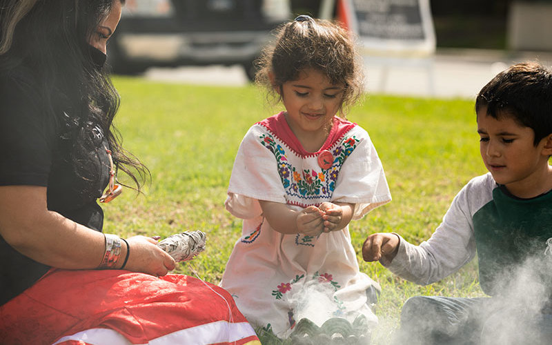 Native Claifornians perform sage ceremony.