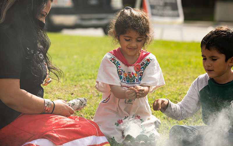 Native Claifornians perform sage ceremony.