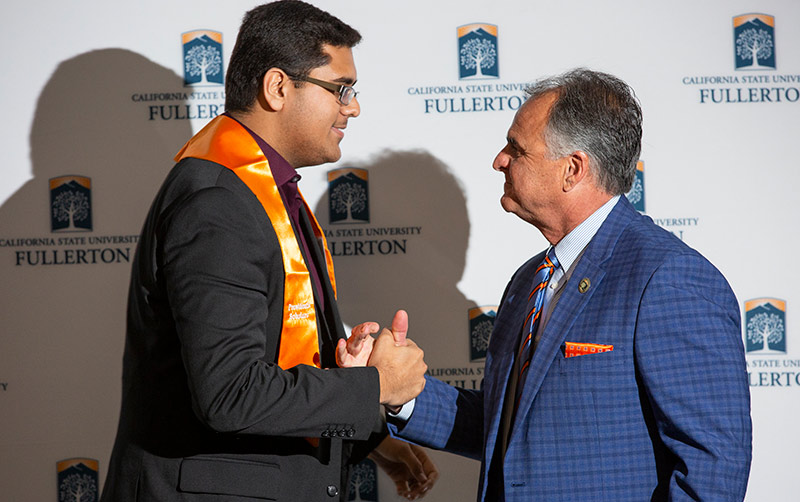 Neel Deshpande with President Virjee.