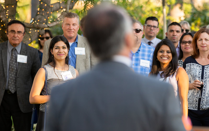 President Virjee greets new faculty.