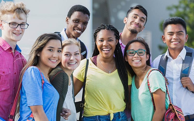 Diverse high school immigrant students learning language.