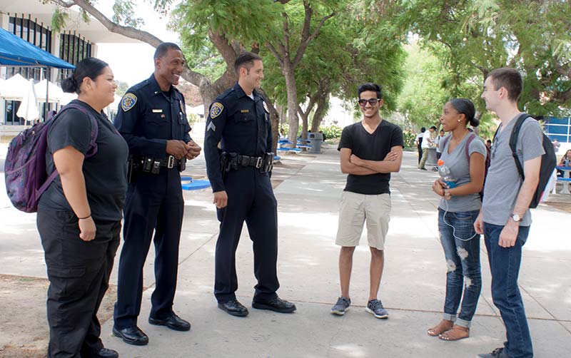 UPD Officers speak to students on campus