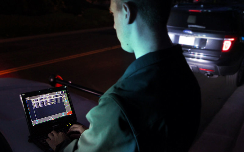 Police officer making traffic stop.