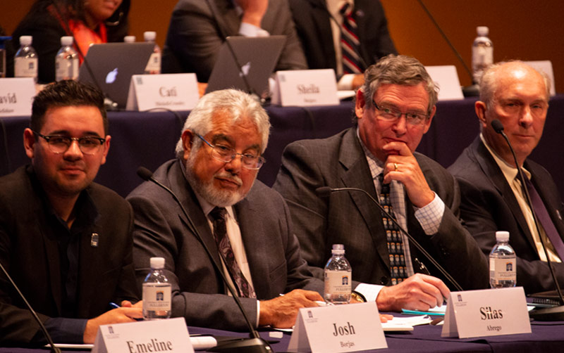 Chancellor White and panel listen to feedback.
