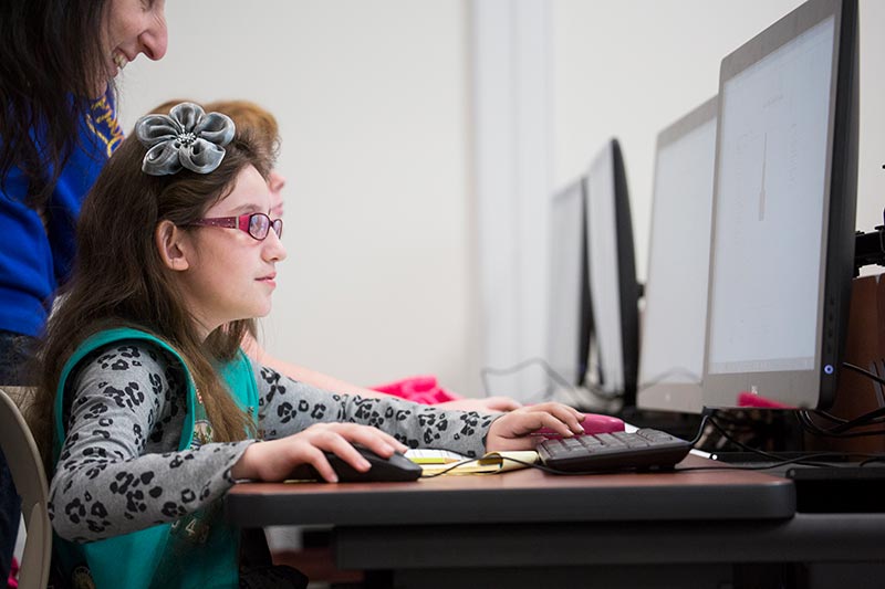Student at computer.