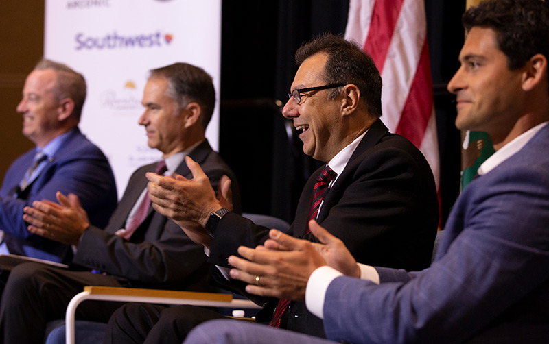 Amir Dabirian and panelists talk to crowd.
