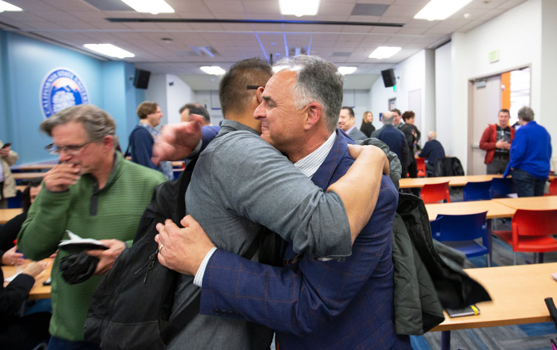 Michael Perez greets Fram Virjee.