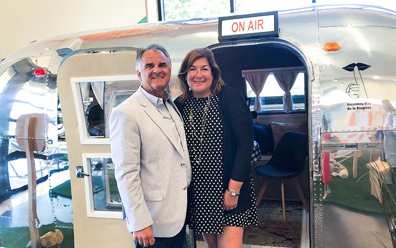 Fram and Julie Virjee at the "Stories From the OC" recording studio.