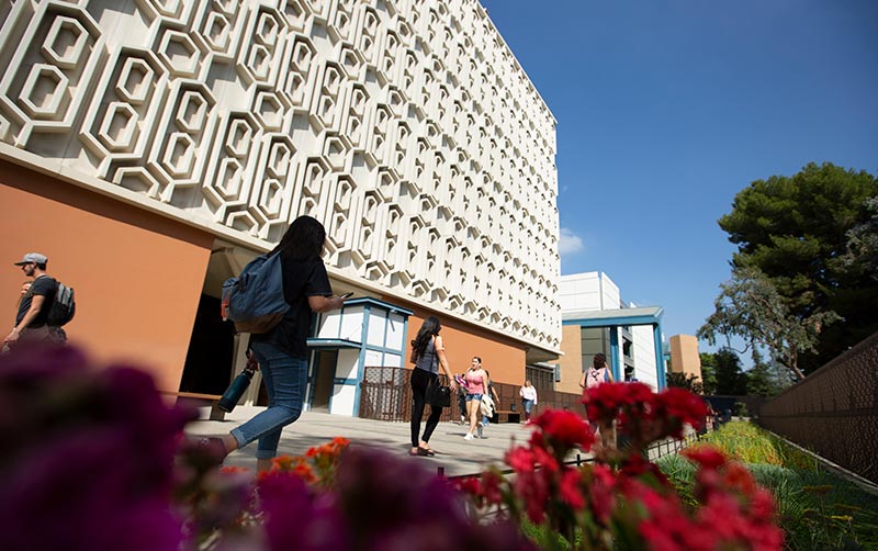CSUF Library with students walking.