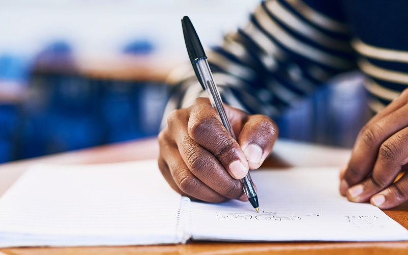 Close up of hand writing.