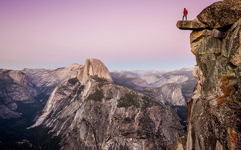 Yosemite valley with hiker in foreground.