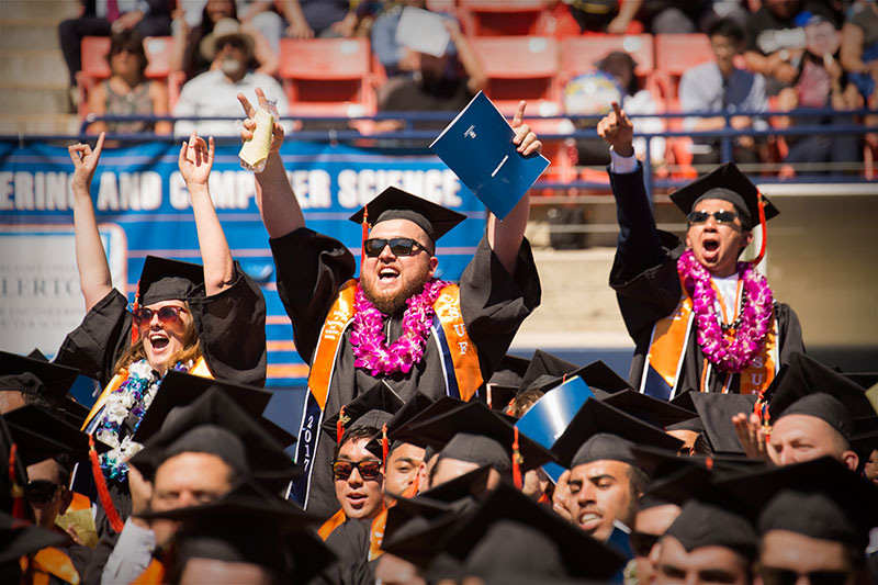 Graduating students cheering