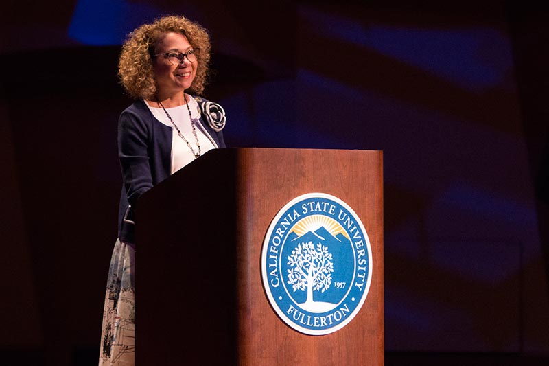 President Mildred Garcia at the podium