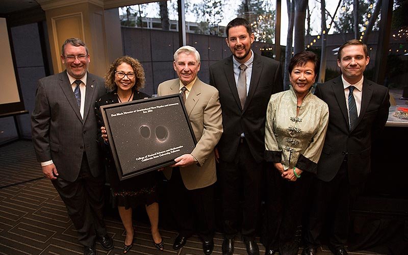 Dan Black presents gift to CSUF dignitaries