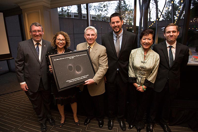 Dan Black presents gift to CSUF dignitaries