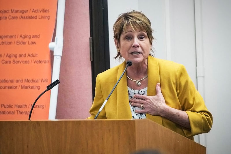 Diane Patterson speaks at podium.