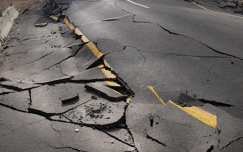 cracked asphalt after earthquake