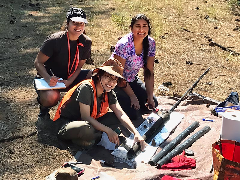 Students collecting soil samples.