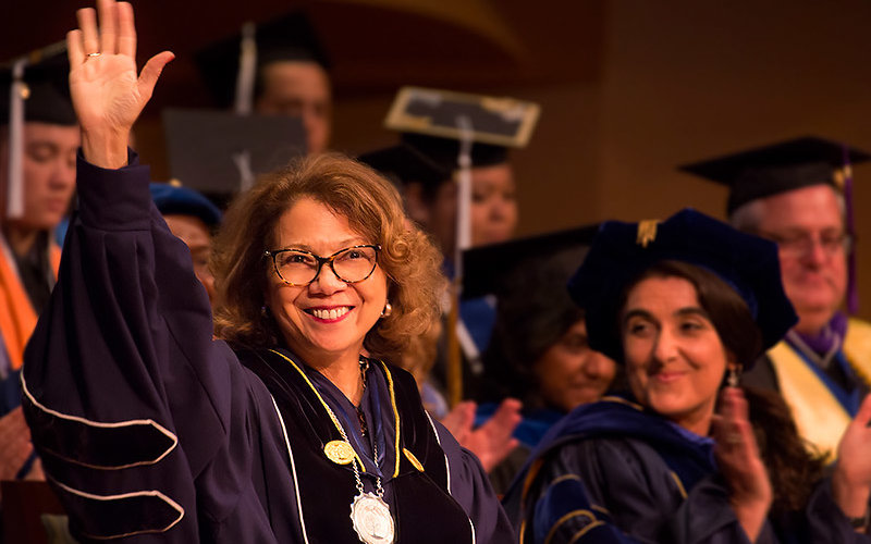 President Mildred García waves to the crowd.