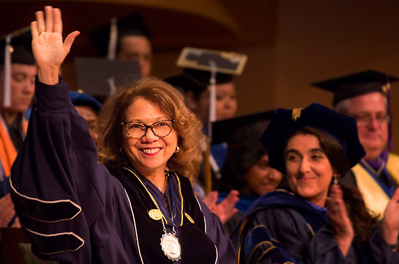 President Mildred García waves to the crowd.