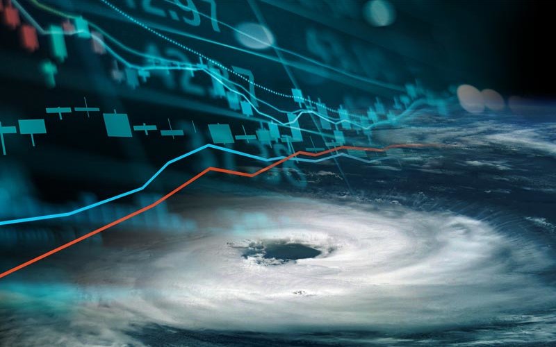 Eye of hurricane from space with financial graphics composite