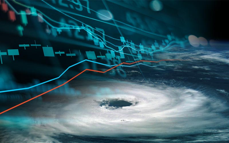Eye of hurricane from space with financial graphics composite