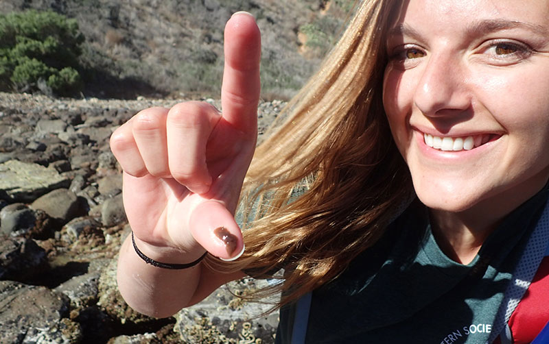 Kelsey Nannini holding a flatworm.