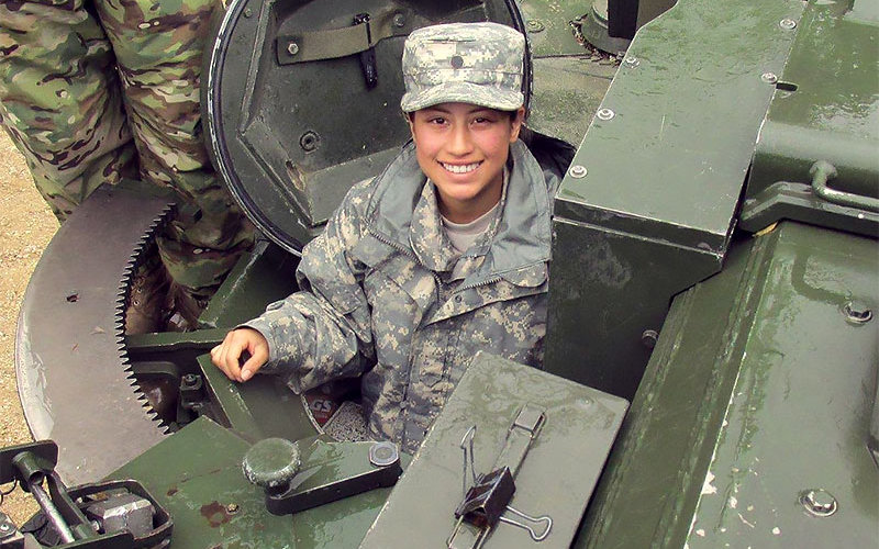 Daisy Larios in a tank.