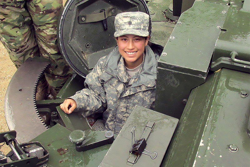 Daisy Larios in a tank.