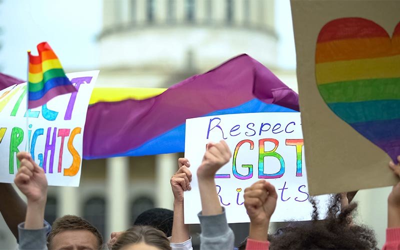Crowd raising posters to respect LGBT rights