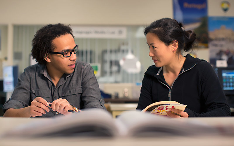 Students reading textbooks.