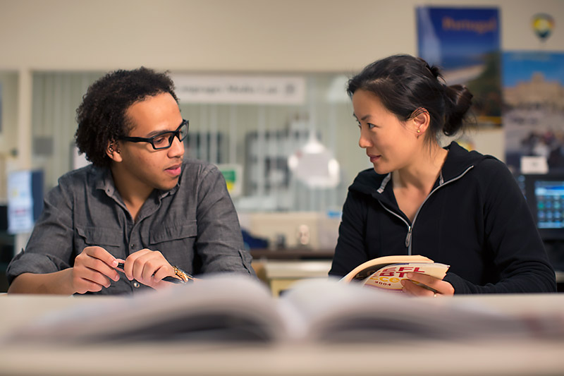 Students reading textbooks.