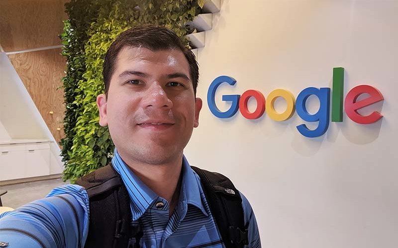 Paul Inventado in front of Google logo