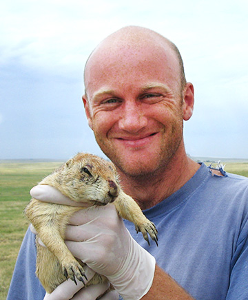 Daniel Salkeld holding a prairie dog
