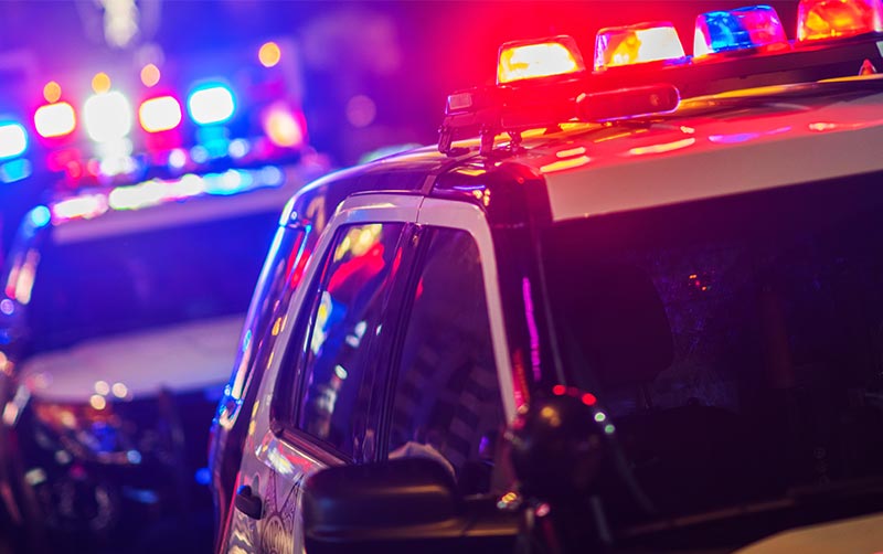 Police car with emergency lights flashing