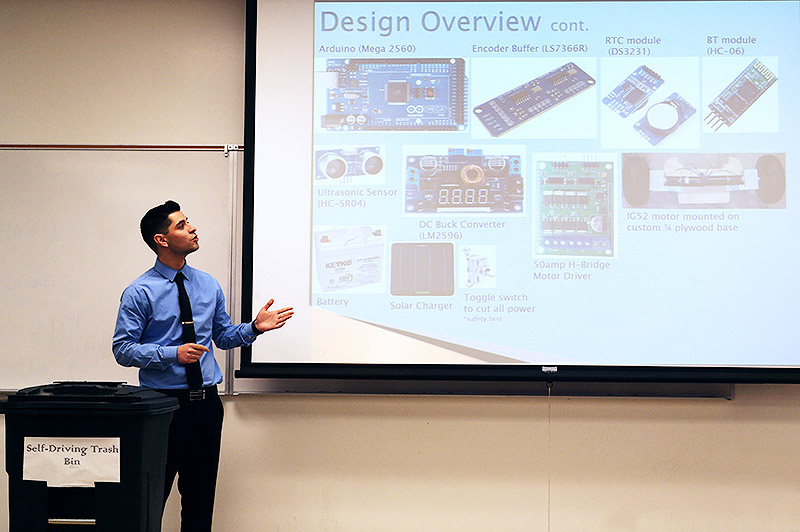 Student Daniel Martinez presenting design of self-driving trash bin