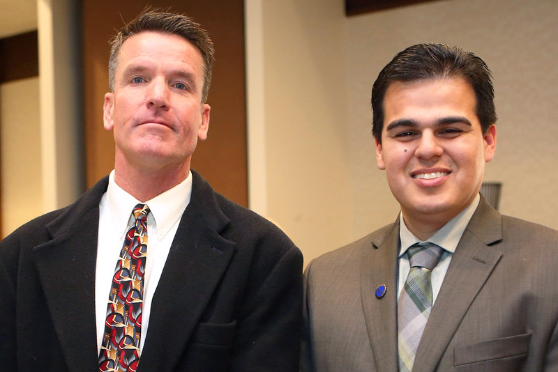 Two men standing side by side