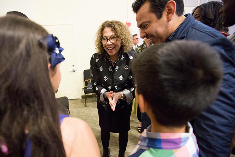 CSUF President Mildren Garcia greets students.