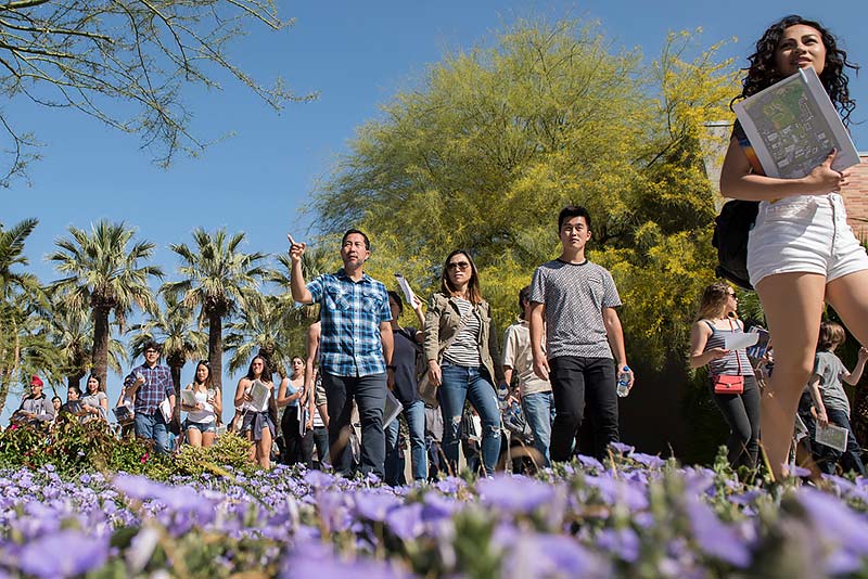 Students and parents walking on campus