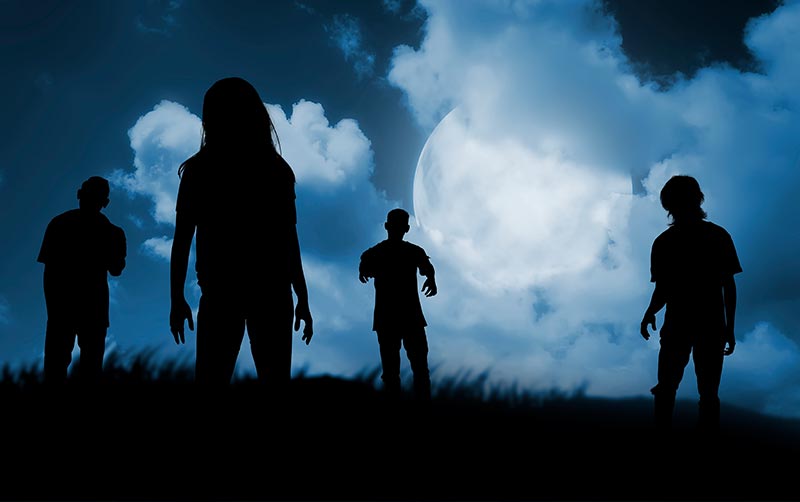 Group of zombies walking at night