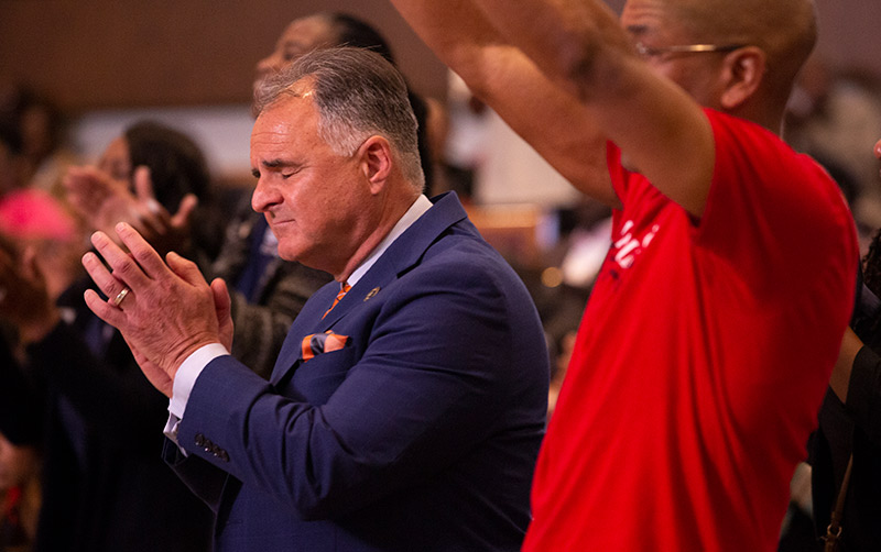 President Virjee praying during Super Sunday