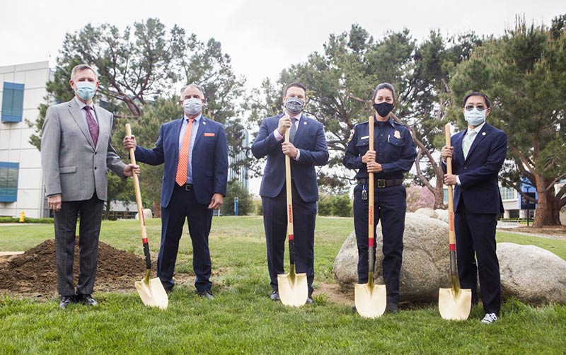 Earth Day tree planting participants with shovels