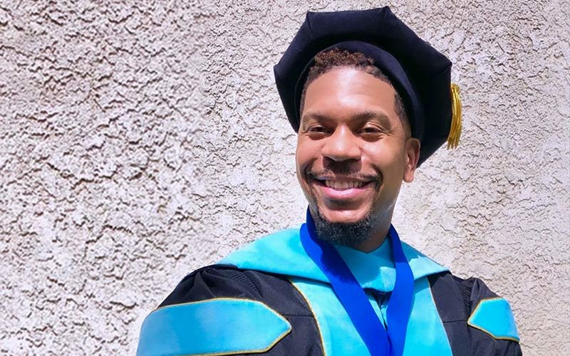 Brandon Harris in commencement regalia