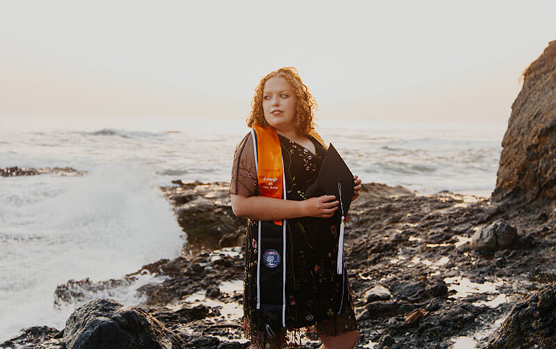 Mia Bullock by the ocean.